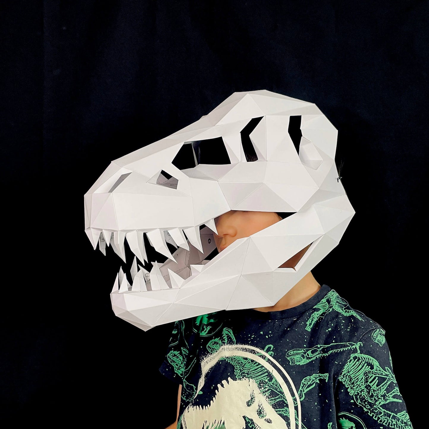 Kid wearing a T-Rex FOSSIL MASK paper template from Lucas PaperLab